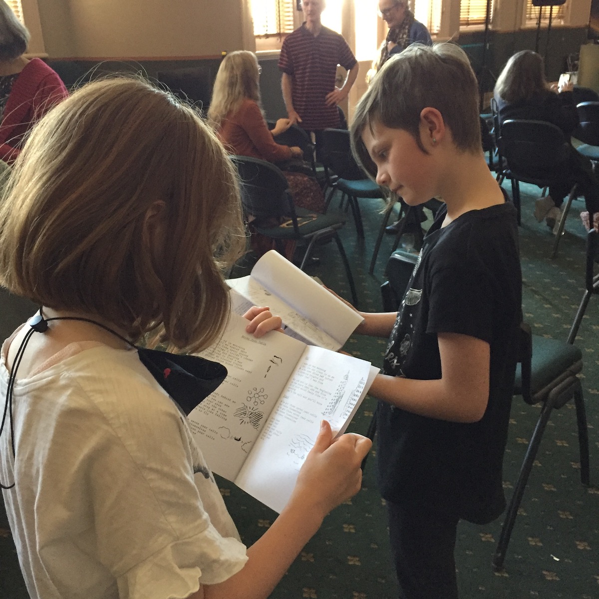 Shadow Feet fans with songbooks